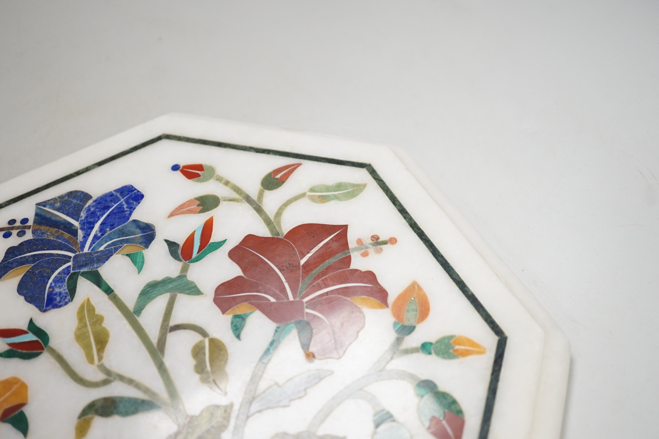 An Agra hardstone inlaid table top. 30cm wide